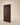 Dark walnut vertical fluted wooden door with steel pin handle, handcrafted in India – modern grooved main door