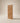 Premium wooden main gate front view in walnut finish featuring chevron pattern panel detailing, modern residential wooden entrance door design and contemporary architectural aesthetics