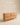 Wooden four-drawer dresser with curved relief-carved geometric front panels, natural light wood finish — handcrafted wooden chest of drawers made in India.