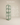 Sage green tall narrow bookshelf with arched and circular cutout shelves, handcrafted in India – modern sculptural wooden display unit