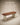 Walnut wood executive desk with oval rounded top, white upholstered drawer cabinet and brass hardware accents — handcrafted luxury office table made in India.