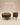 Round wooden coffee table set with walnut wood grain finish, fluted vertical slat panels and tapered legs — handcrafted dark wood coffee table made in India.