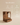 Wooden bedside table with arched alcove niche and pull-out drawer, walnut finish with brass knob — handcrafted wooden nightstand made in India.