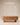 Oval wooden coffee table with mixed asymmetric legs — one ball foot, one frame leg — natural light wood finish, handcrafted modern coffee table made in India.