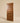 Front view of a contemporary walnut wooden front door featuring horizontal panel detailing and rich natural wood grain.