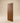 Pencil sketch of a contemporary walnut wooden entrance door featuring diagonal plank design, framed construction, and a long fluted pull handle.