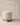Cylindrical bouclé fabric ottoman with cross-frame wooden base, natural wood finish — handcrafted accent stool made in India.