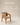 Wooden dining armchair with grey cushioned seat and backrest, handcrafted in India – modern teak dining chair with arms