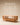 Oval wooden coffee table with spindle slat sides, open lower shelf and natural light wood finish — handcrafted solid wood coffee table made in India.