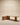 Light oak L-shaped executive desk with rounded edges, cylindrical pillar leg and fluted drawer cabinet — handcrafted modern office desk made in India.