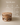 Round wooden coffee table with two-tier open shelf design, handcrafted in India – solid wood drum-style coffee table