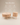 Round wooden coffee table set with natural light oak finish, fluted vertical slat design and tapered legs — handcrafted solid wood coffee table made in India.