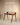 Walnut wood writing desk with curved raised back shelf and angled splayed legs, mid-century modern design — handcrafted wooden study table made in India.