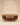 Round wooden coffee table with fluted side panels, open lower shelf and tapered legs, walnut finish — handcrafted solid wood coffee table made in India.
