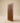 Premium solid wood main door front view featuring a recessed vertical slatted center panel with chamfered corners, rich walnut wood grain finish and modern minimalist entrance door design