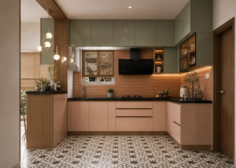 Modern kitchen with green cabinets, black countertops, and a tiled floor.